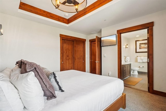 1521 Ski Hill Rd Unit 8312, Breckenridge, CO 80424 - bedroom with ensuite bathroom, a tray ceiling, and carpet floors