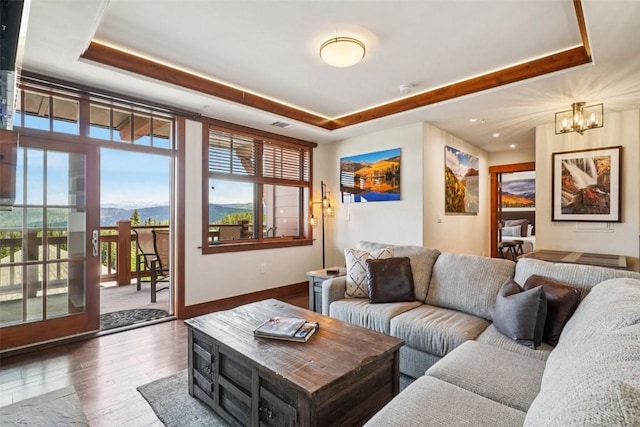 1521 Ski Hill Rd Unit 8312, Breckenridge, CO 80424 - living room with a raised ceiling, hardwood / wood-style floors, a chandelier, and recessed lighting