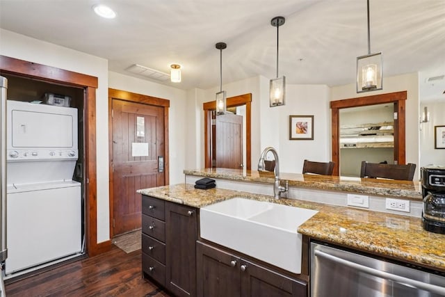 1521 Ski Hill Rd Unit 8312, Breckenridge, CO 80424 - kitchen featuring estacked washer and dryer, dark wood finished floors, dishwasher, and dark brown cabinets