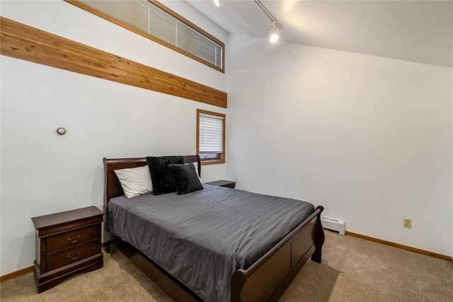 91200 Ryan Gulch Rd Unit 91222, Silverthorne, CO 80498 - carpeted bedroom with rail lighting, a baseboard heating unit, baseboards, and vaulted ceiling