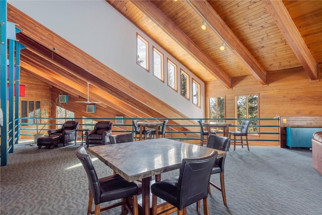 91200 Ryan Gulch Rd Unit 91222, Silverthorne, CO 80498 - carpeted dining space with wood walls, wooden ceiling, beam ceiling, and high vaulted ceiling