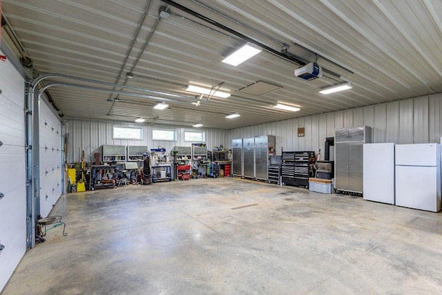26870 Beaver Canyon Dr, Clark, CO 80428 - garage with freestanding refrigerator and a garage door opener