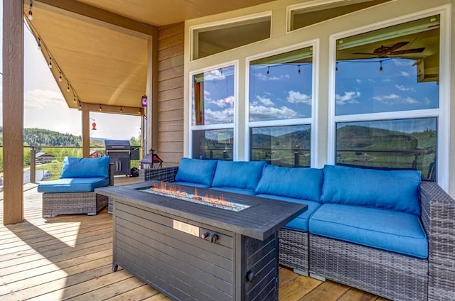 26870 Beaver Canyon Dr, Clark, CO 80428 - deck featuring an outdoor living space with a fire pit and area for grilling