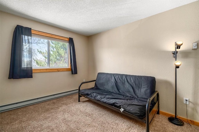3 Cypress Ct Unit 3, Steamboat Springs, CO 80487 - living area featuring a textured ceiling, a baseboard heating unit, baseboards, and carpet
