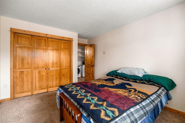 3 Cypress Ct Unit 3, Steamboat Springs, CO 80487 - carpeted bedroom with a textured ceiling, baseboards, a closet, and washer / clothes dryer