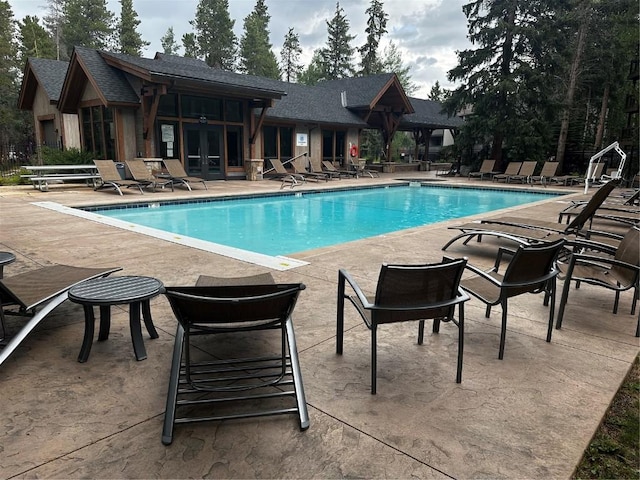 815 Columbine Rd Unit 22, Breckenridge, CO 80424 - community pool with french doors and a patio area