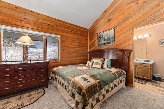 1149 Overlook Dr Unit C3, Steamboat Springs, CO 80487 - bedroom featuring ensuite bath, vaulted ceiling, and wood walls