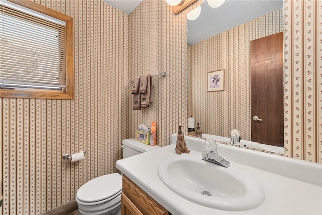1149 Overlook Dr Unit C3, Steamboat Springs, CO 80487 - bathroom with toilet, vanity, and wallpapered walls