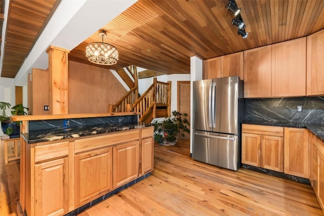 50035 Moon Hill Dr, Steamboat Springs, CO 80487 - kitchen featuring freestanding refrigerator, wood ceiling, a chandelier, light wood finished floors, and decorative backsplash