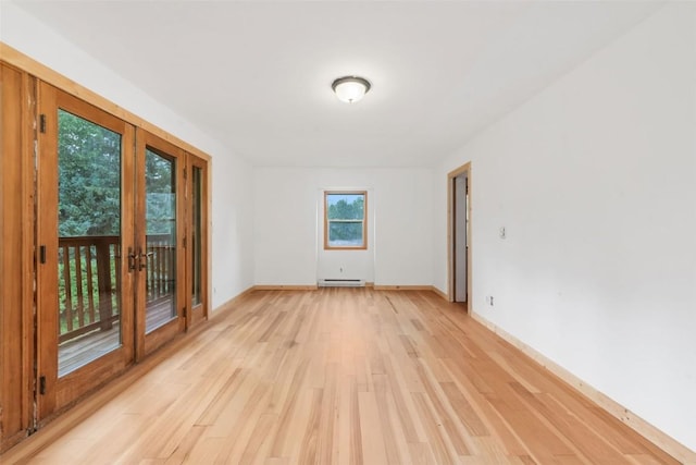 50035 Moon Hill Dr, Steamboat Springs, CO 80487 - unfurnished room with light wood-type flooring, french doors, and a baseboard radiator