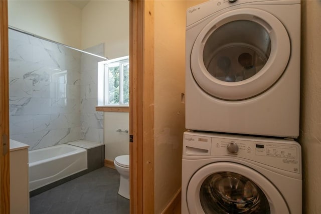 5277 Montezuma Rd, Montezuma, CO 80435 - laundry room featuring tile patterned flooring and stacked washer and clothes dryer