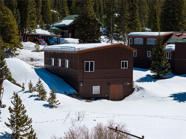 5277 Montezuma Rd, Montezuma, CO 80435 - exterior space featuring a view of trees and board and batten siding