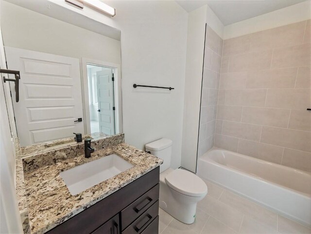 bathroom with toilet, tile patterned floors, vanity, and shower / washtub combination
