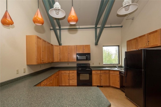 kitchen featuring high vaulted ceiling, dark countertops, a sink, black appliances, and a peninsula