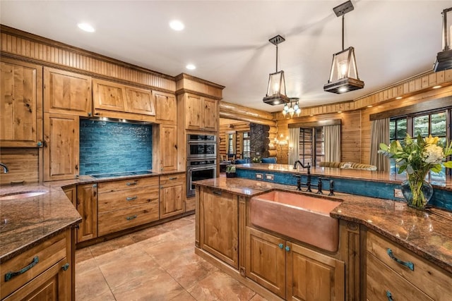 486 Sage Creek Canyon Dr, Silverthorne, CO 80498 - kitchen featuring stainless steel double oven, brown cabinets, pendant lighting, black electric cooktop, and recessed lighting