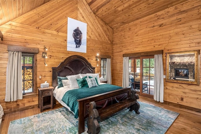 486 Sage Creek Canyon Dr, Silverthorne, CO 80498 - bedroom with multiple windows, access to outside, high vaulted ceiling, wooden walls, and wooden ceiling