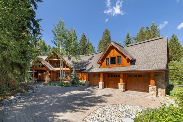 486 Sage Creek Canyon Dr, Silverthorne, CO 80498 - log cabin with stone siding and decorative driveway