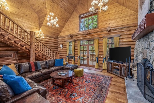 486 Sage Creek Canyon Dr, Silverthorne, CO 80498 - living room featuring a chandelier, high vaulted ceiling, rustic walls, wood ceiling, and stairway