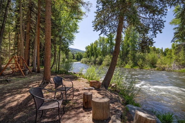 486 Sage Creek Canyon Dr, Silverthorne, CO 80498 - view of patio / terrace featuring a water view and a forest view