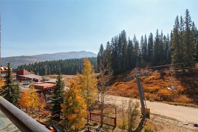 view of mountain feature featuring a forest view