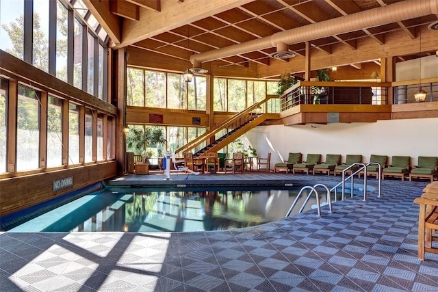 pool with a patio and stairs