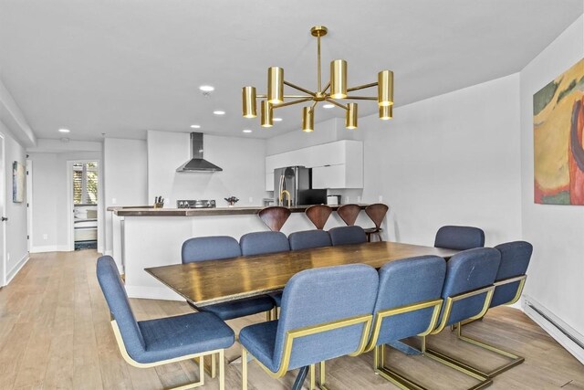 1724 Ski Time Square Dr Unit R6, Steamboat Springs, CO 80487 - dining space with baseboard heating, recessed lighting, light wood-style floors, baseboards, and a chandelier