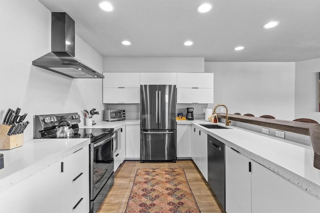 1724 Ski Time Square Dr Unit R6, Steamboat Springs, CO 80487 - kitchen featuring appliances with stainless steel finishes, a sink, range hood, light countertops, and white cabinets