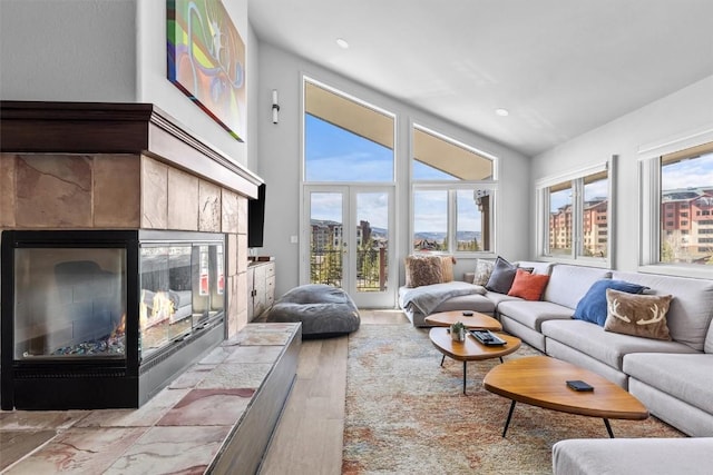 1724 Ski Time Square Dr Unit R6, Steamboat Springs, CO 80487 - living area with a fireplace, wood finished floors, recessed lighting, and french doors