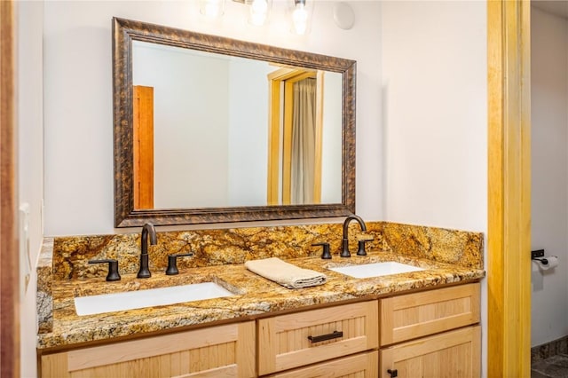 bathroom with double vanity and a sink