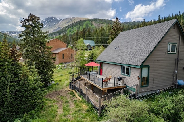 46 Mcdill Rd, Breckenridge, CO 80424 - rear view of property with roof with shingles and a deck with mountain view