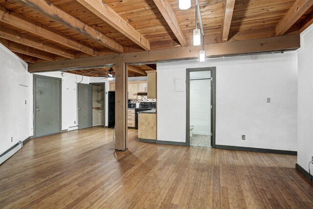 8500 Ryan Gulch Rd Unit G2, Wildernest, CO 80498 - basement featuring light wood-type flooring, wood ceiling, baseboards, a ceiling fan, and a baseboard radiator