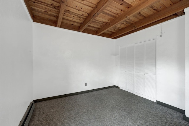 8500 Ryan Gulch Rd Unit G2, Wildernest, CO 80498 - carpeted empty room with wood ceiling with exposed beams, a baseboard heating unit, and baseboards