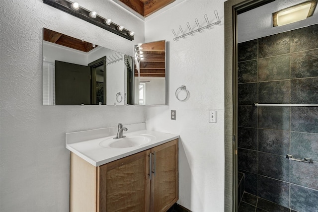 8500 Ryan Gulch Rd Unit G2, Wildernest, CO 80498 - bathroom featuring a textured wall and vanity