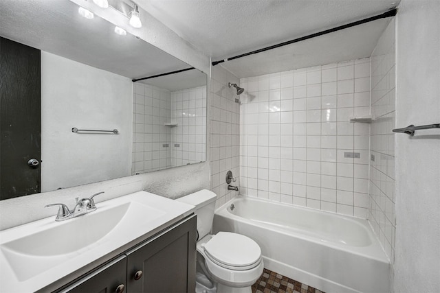 8500 Ryan Gulch Rd Unit G2, Wildernest, CO 80498 - bathroom featuring toilet, washtub / shower combination, vanity, and a textured ceiling