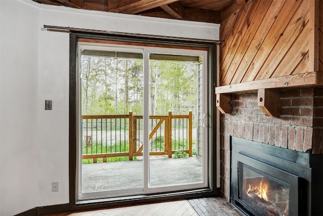 8500 Ryan Gulch Rd Unit G2, Wildernest, CO 80498 - doorway to outside with healthy amount of natural light and a fireplace