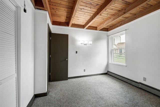 8500 Ryan Gulch Rd Unit G2, Wildernest, CO 80498 - unfurnished room with a baseboard radiator, wooden ceiling with exposed beams, carpet flooring, and baseboards