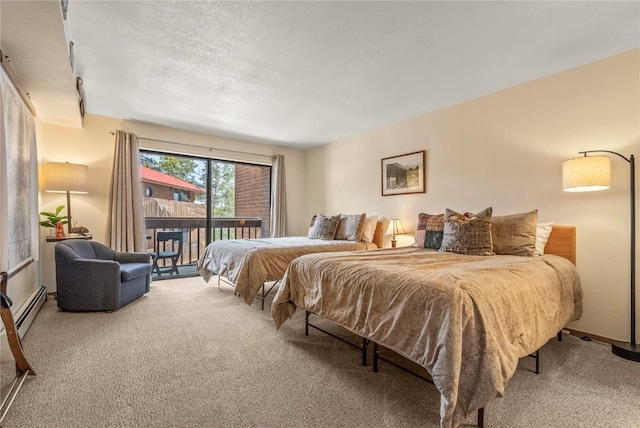 carpeted bedroom featuring access to outside, a baseboard heating unit, and a textured ceiling