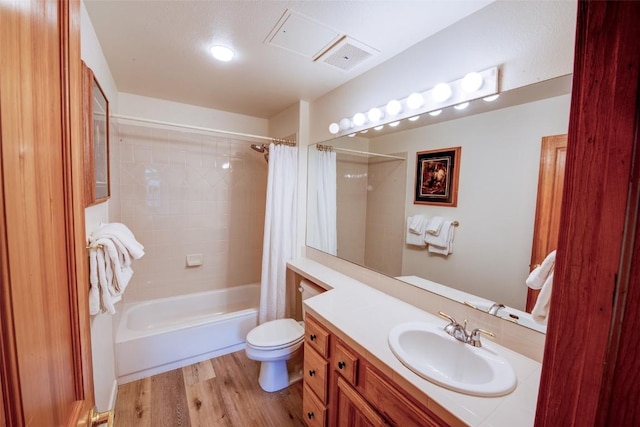 23110 US Highway 6 Unit 319, Keystone, CO 80435 - bathroom with vanity, wood finished floors, and shower / bath combo with shower curtain