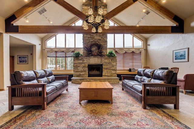 23110 US Highway 6 Unit 319, Keystone, CO 80435 - living area with beamed ceiling, high vaulted ceiling, rail lighting, and a fireplace