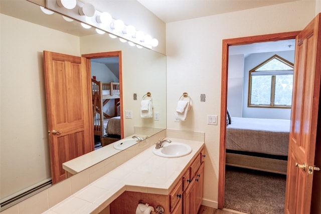 23110 US Highway 6 Unit 319, Keystone, CO 80435 - bathroom with ensuite bathroom, vanity, and a baseboard radiator