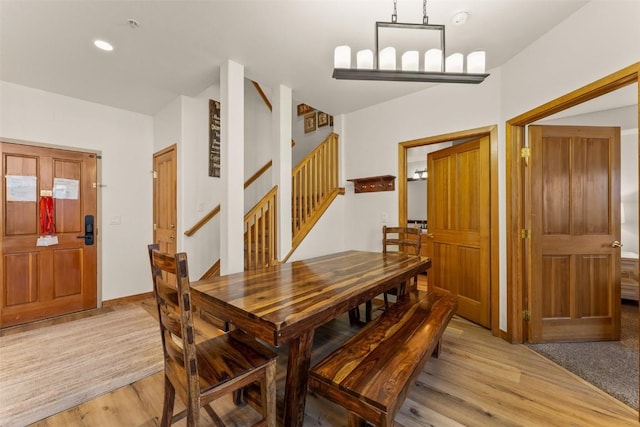 23110 US Highway 6 Unit 319, Keystone, CO 80435 - dining area featuring light wood-style flooring and stairway