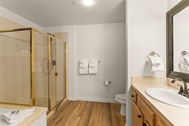 23110 US Highway 6 Unit 319, Keystone, CO 80435 - bathroom featuring a stall shower, vanity, and wood finished floors