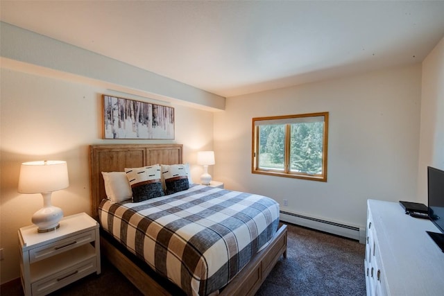 23110 US Highway 6 Unit 319, Keystone, CO 80435 - bedroom with baseboard heating and dark carpet