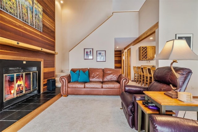 91200 Ryan Gulch Rd Unit 91223, Silverthorne, CO 80498 - living room with a towering ceiling, a tiled fireplace, and recessed lighting
