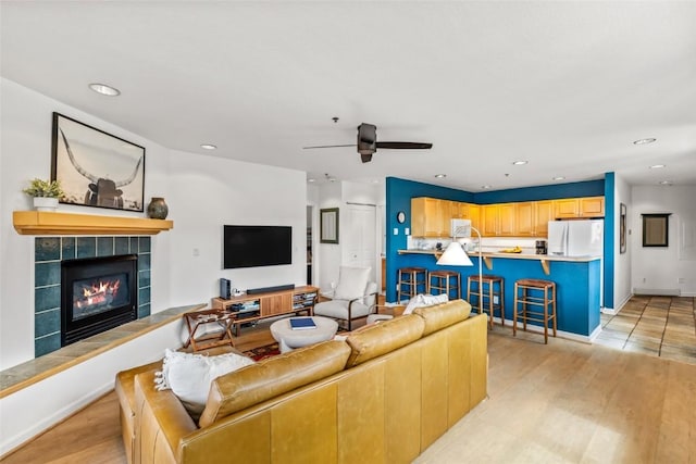 2700 Eagleridge Dr Unit N31, Steamboat Springs, CO 80487 - living area with ceiling fan, recessed lighting, light wood-style flooring, and a tiled fireplace