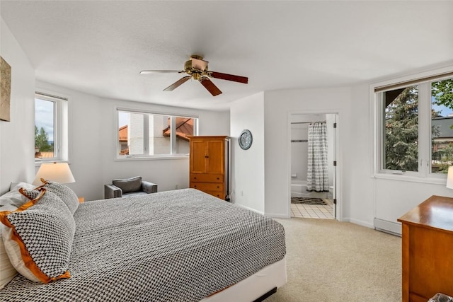 2700 Eagleridge Dr Unit N31, Steamboat Springs, CO 80487 - bedroom with light carpet, baseboards, a baseboard radiator, and ensuite bath