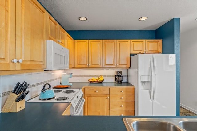 2700 Eagleridge Dr Unit N31, Steamboat Springs, CO 80487 - kitchen featuring white appliances, decorative backsplash, and recessed lighting