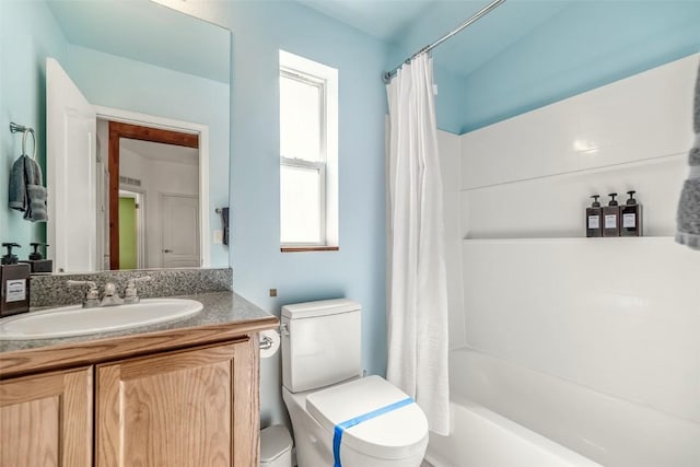 972 N Quarter Horse Rd, Jefferson, CO 80456 - bathroom with shower / bath combination with curtain, toilet, a healthy amount of sunlight, and vanity