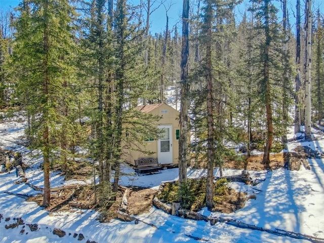 972 N Quarter Horse Rd, Jefferson, CO 80456 - view of snowy exterior with an outbuilding