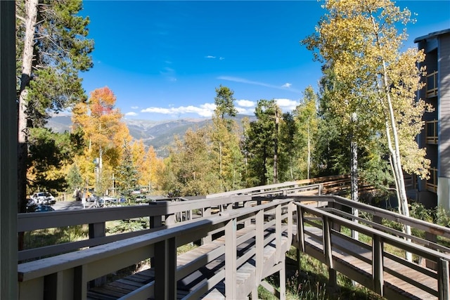balcony with a view of trees and a mountain view